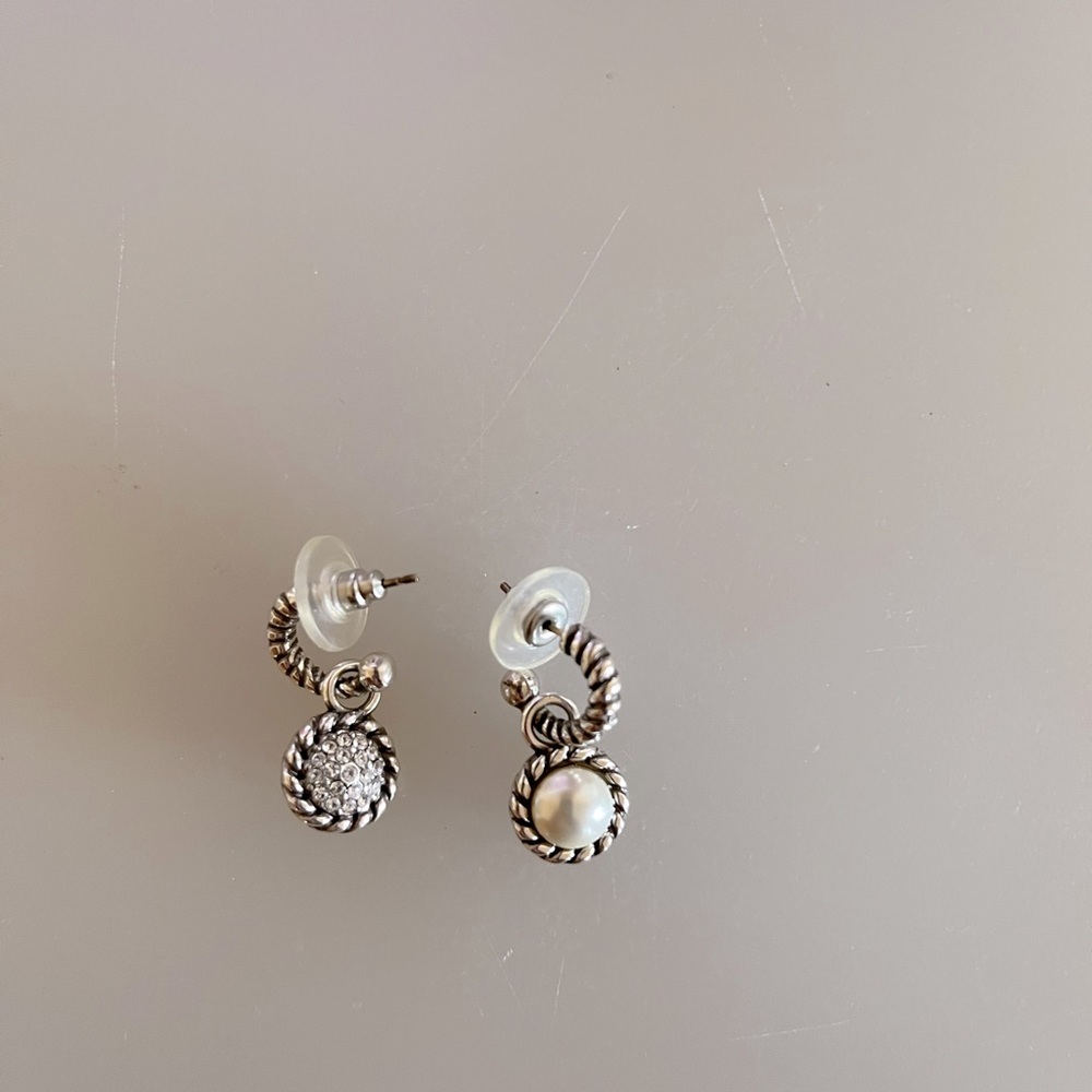 Post earrings. One side is pearl like. Other side is facet like.